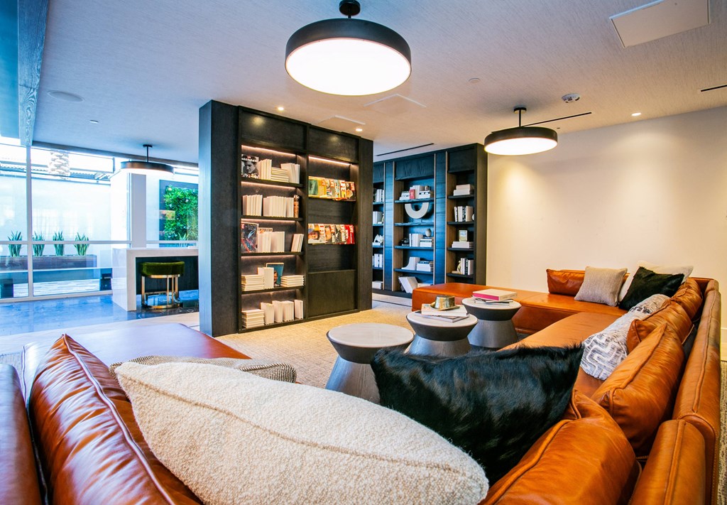 Lounge area filled with furniture and a bookshelf