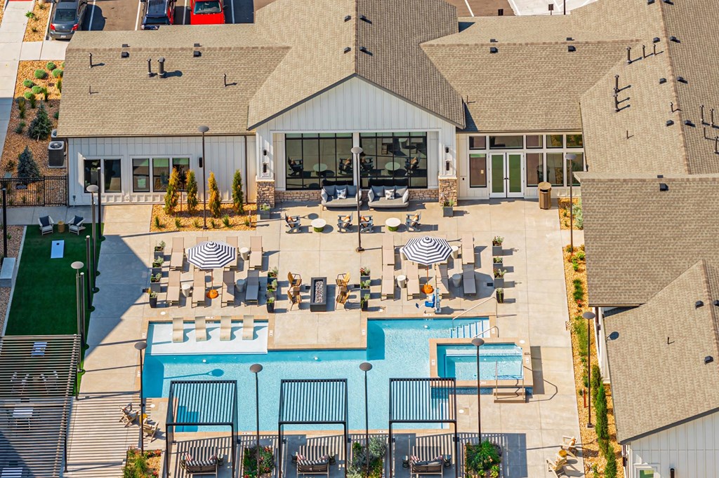 A large building with a pool in front.