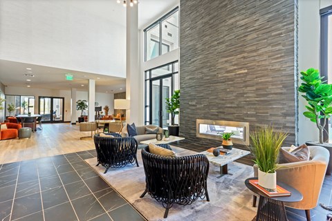 Living room with a fireplace and a large window at Array La Mesa, California