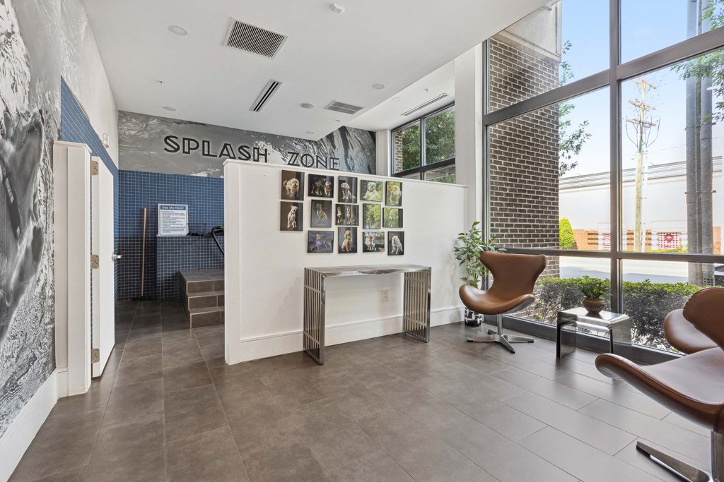 an office with a large window and a desk with a chair