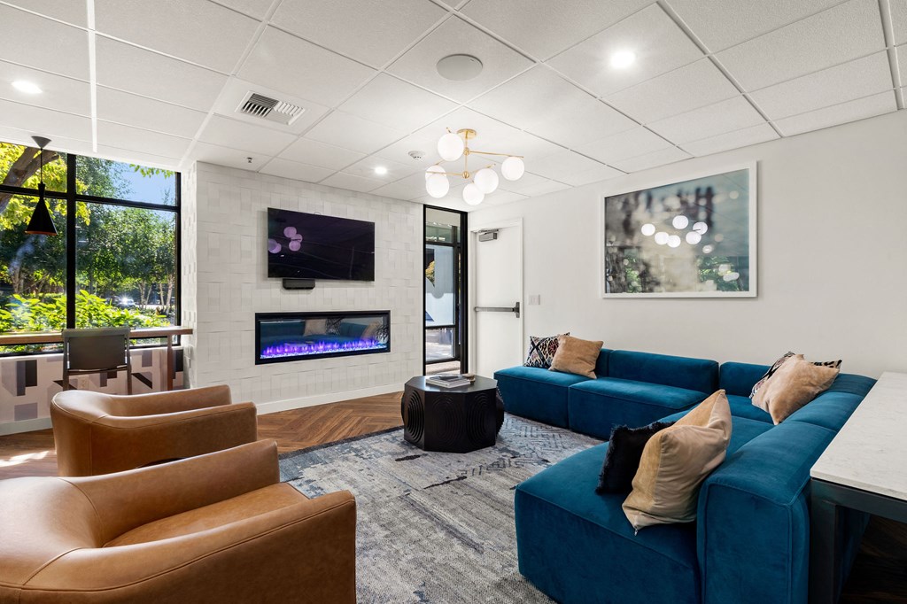 the preserve at ballantyne commons community living room with couches and a fireplace