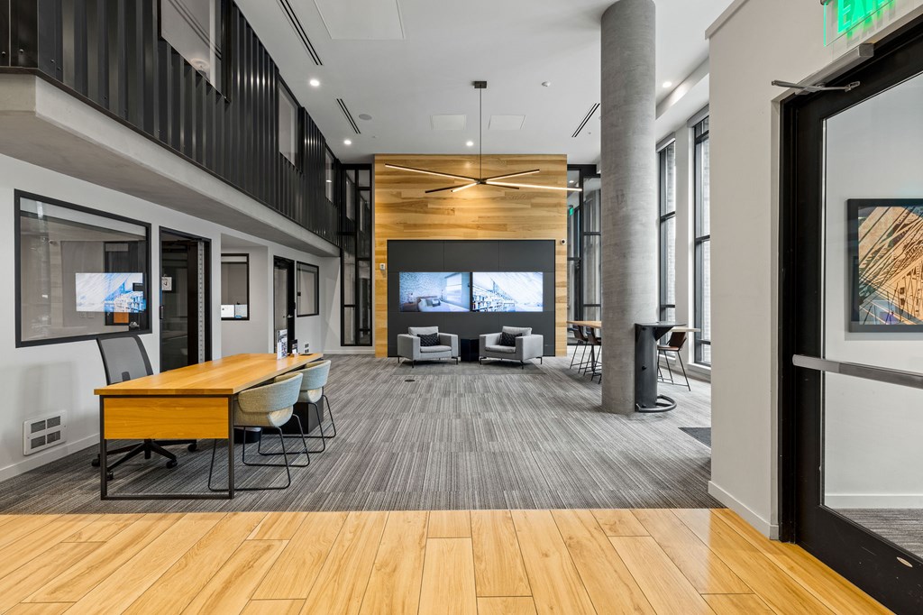 A conference room with a long table and chairs.