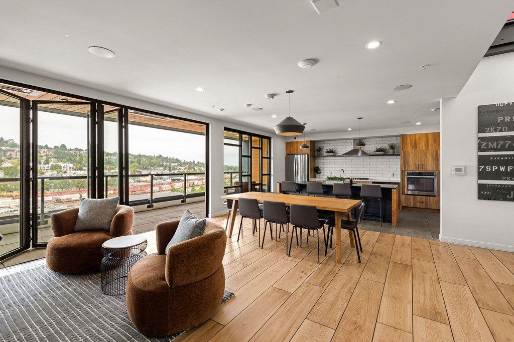 A modern living room with a dining table and chairs.