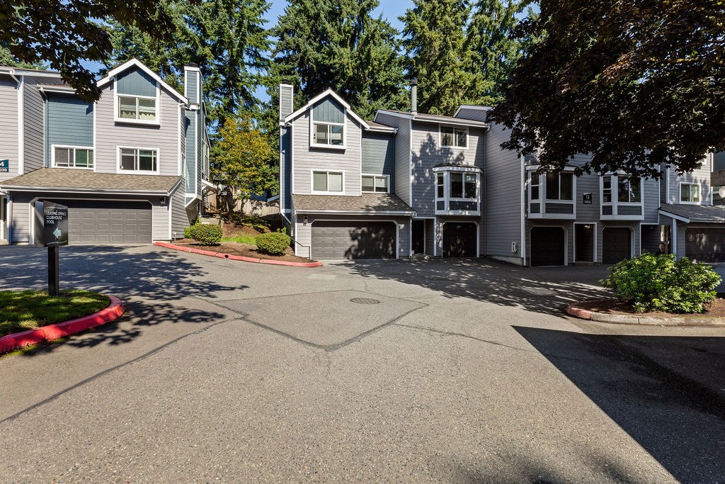 A view of a residential area with houses and trees.