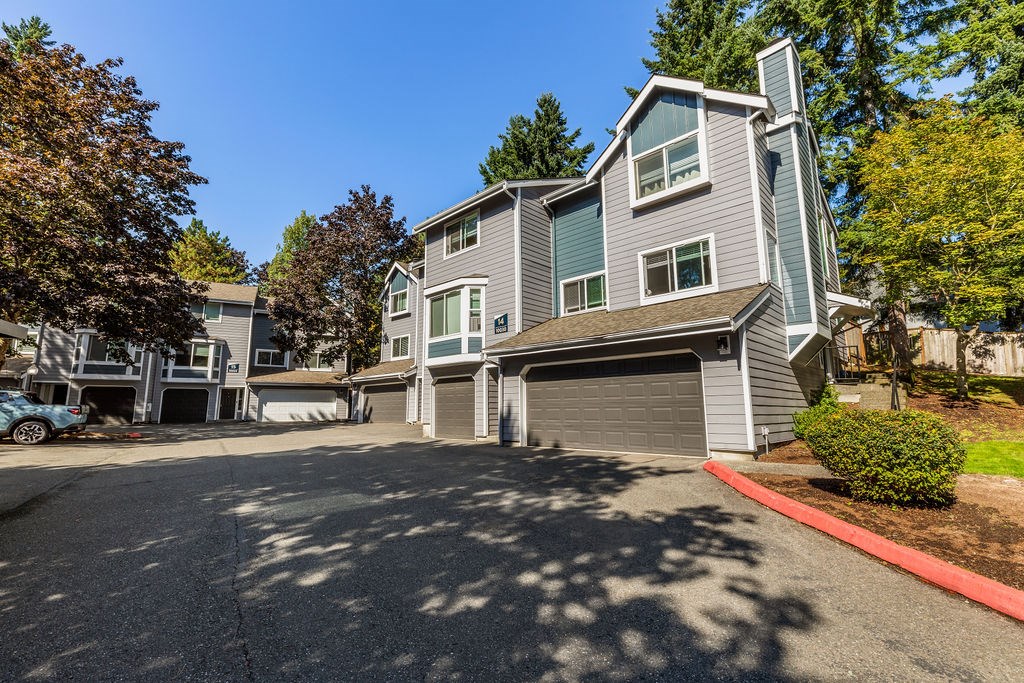A modern two-story house with a garage.