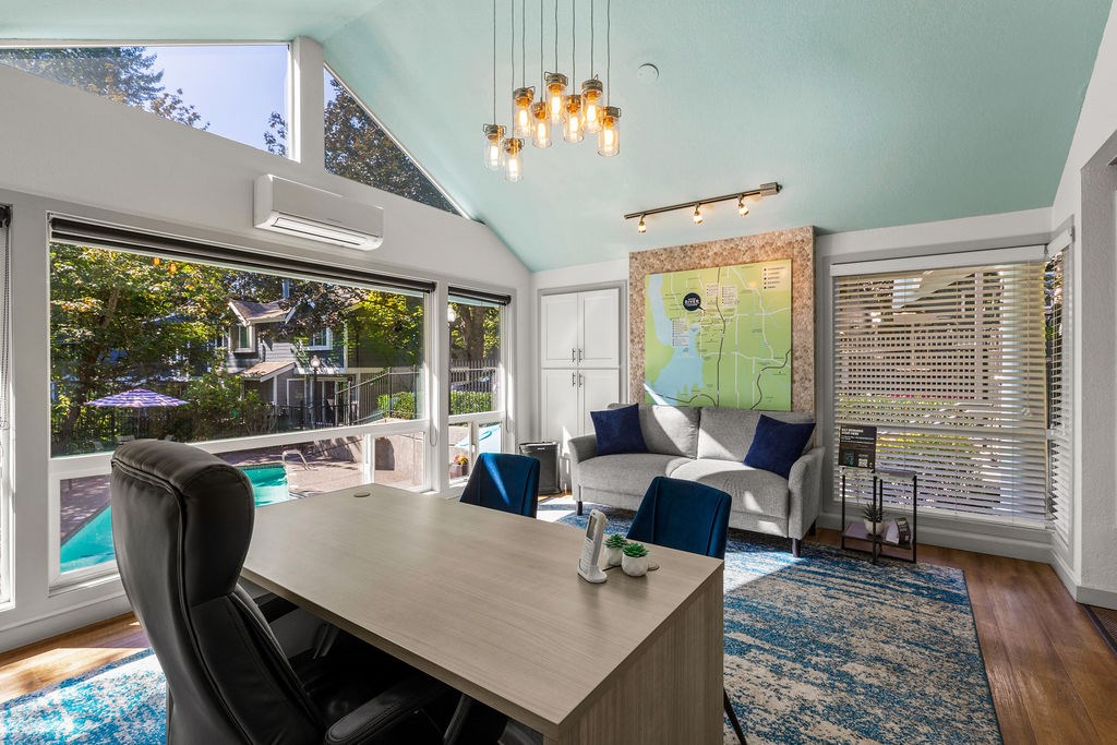 A room with a table and chairs and a map on the wall.