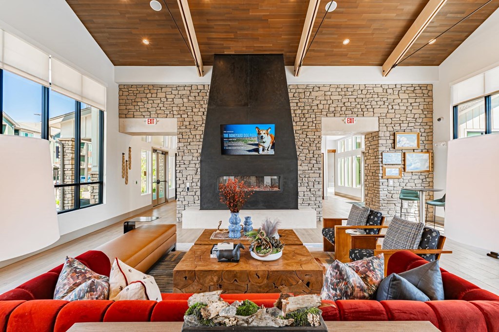 Clubhouse Great Room with large fireplace and TV