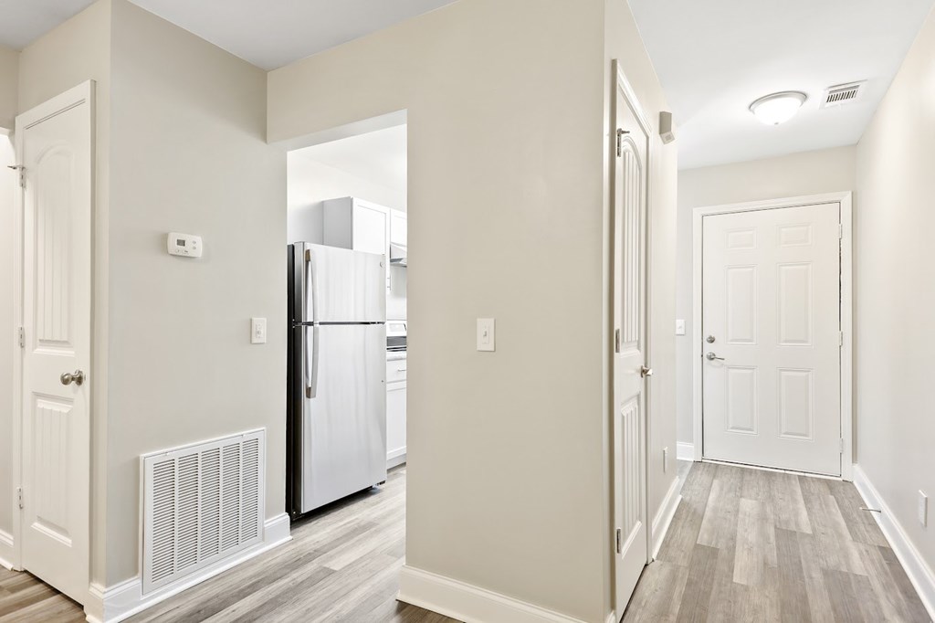 A white door is on the left side of the image.