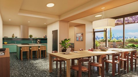 A dining room with a long table and chairs.