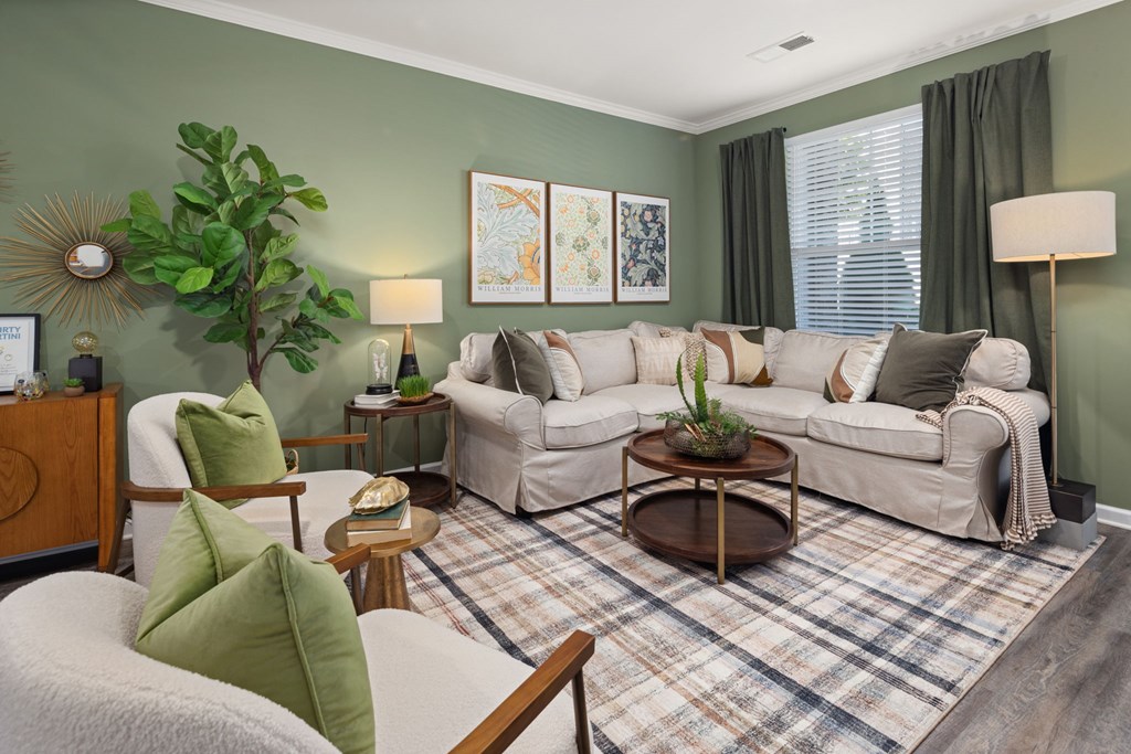 A living room with a couch, chair, and a coffee table.