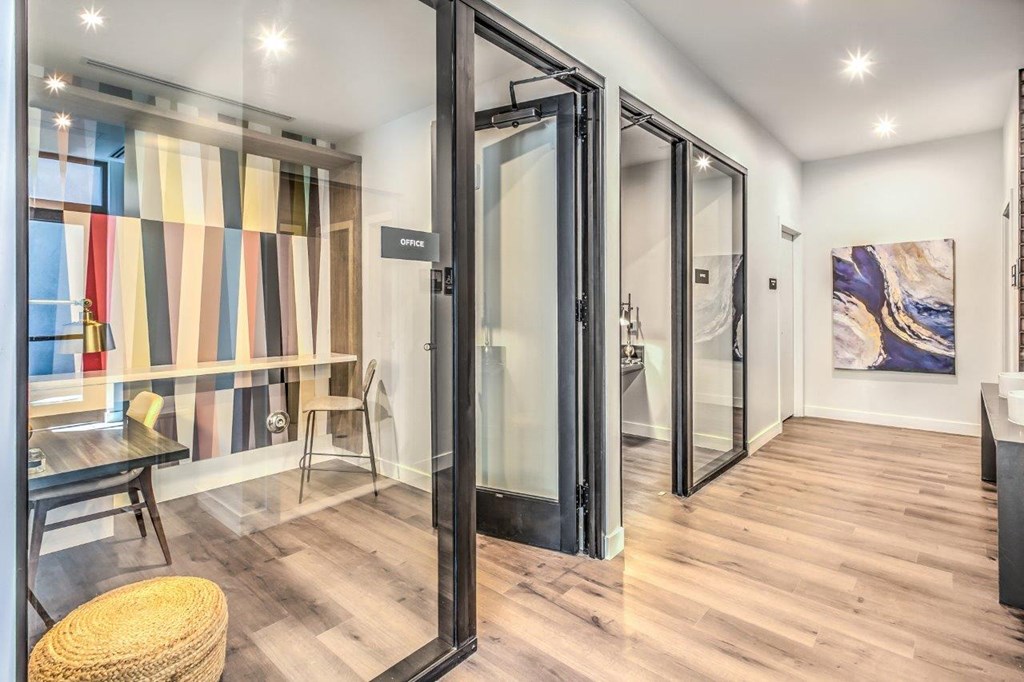 Private workspace with hardwood floors and glass doors
