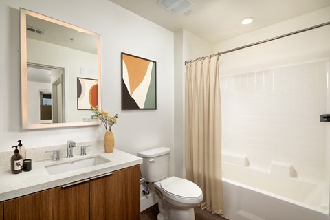 a bathroom with a toilet sink and bathtub