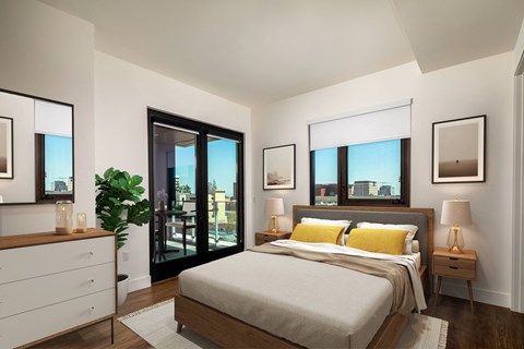 a bedroom with a bed and two windows