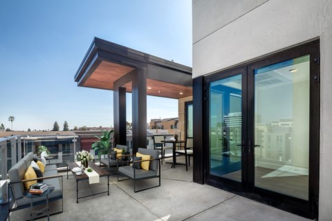 a terrace with a table and chairs