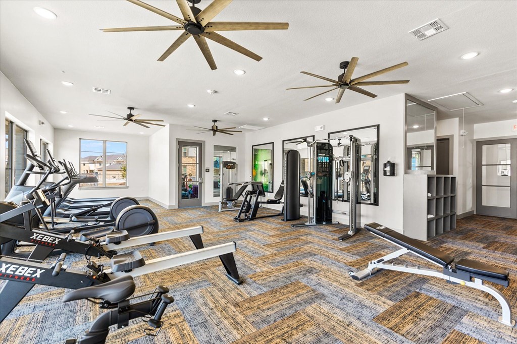 fitness center with enclosed yoga room