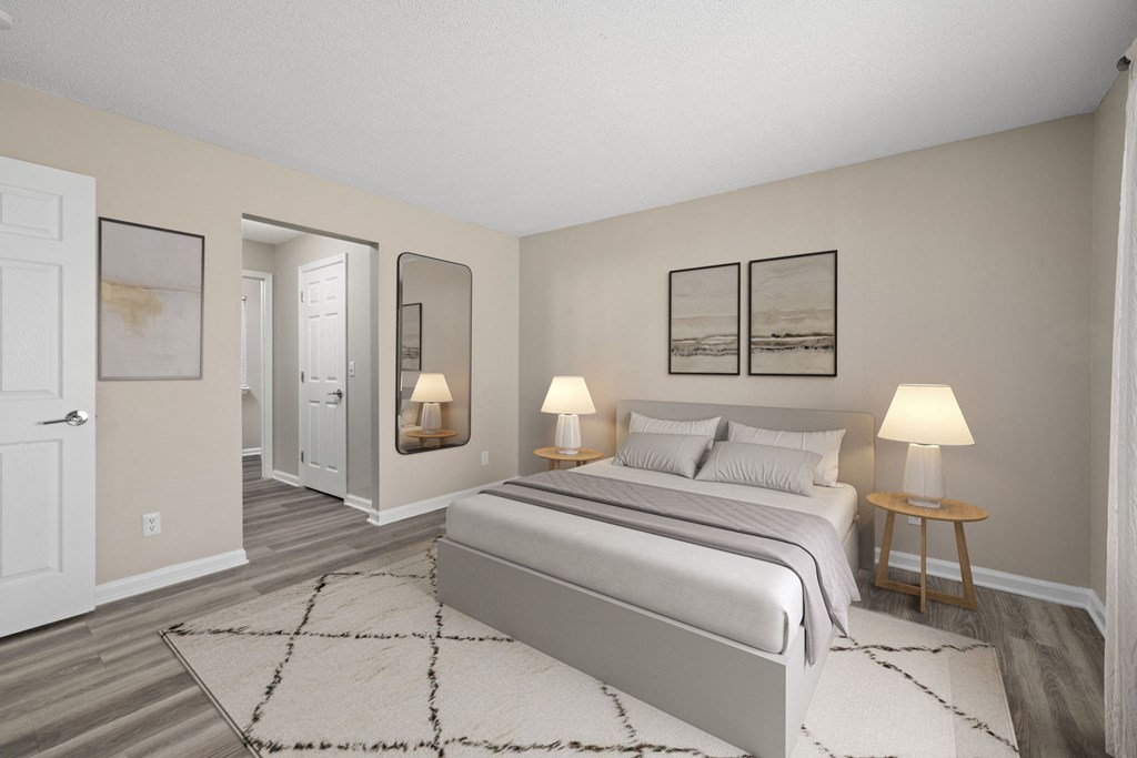 a bedroom with a bed and a rug