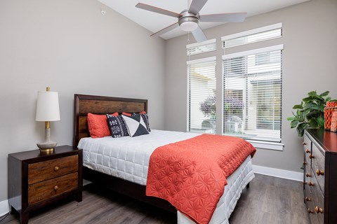 Hardwood floor bedroom with ceiling fan