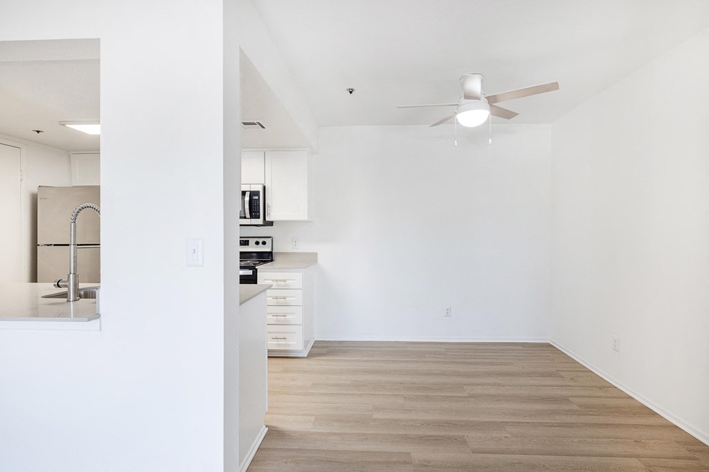 a bedroom with a medium sized bed and a ceiling fan