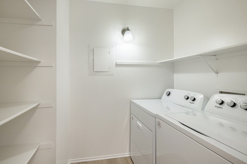 a laundry room with a washer and dryer