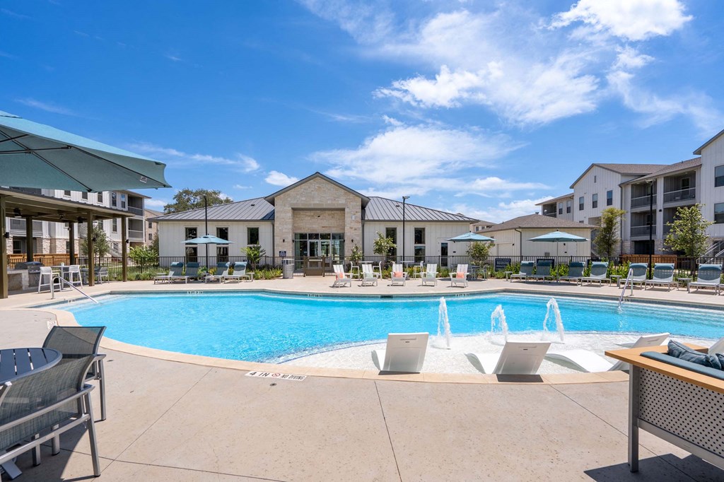 our apartments offer a swimming pool with chairs and umbrellas
