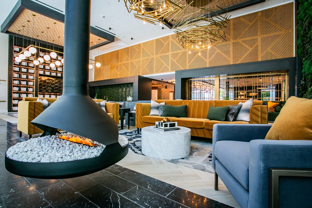 a lobby with a fireplace and couches