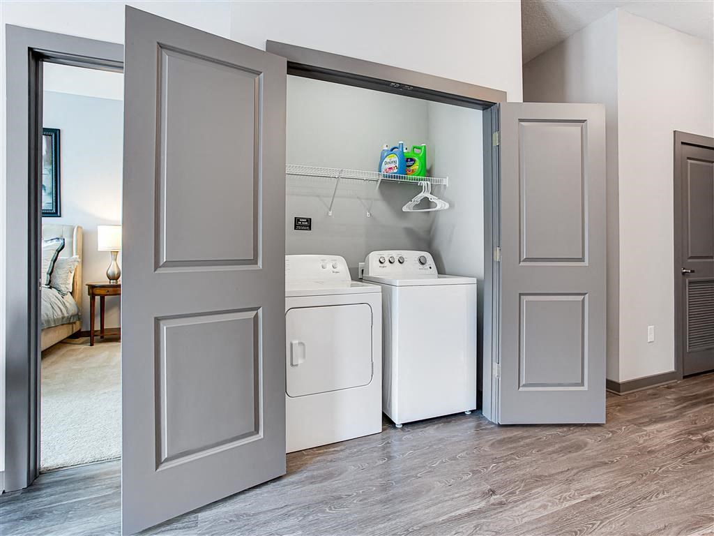 a laundry room with a washer and dryer