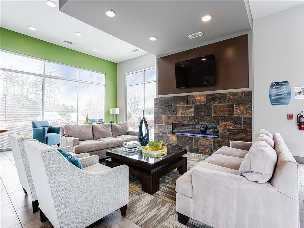 a living room filled with furniture and a fire place