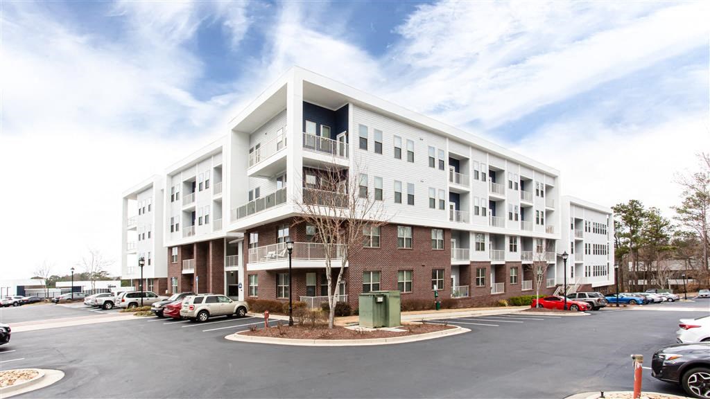 a building with a parking lot in front of it