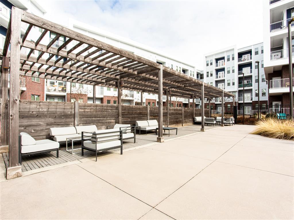 a group of benches sitting on top of a patio