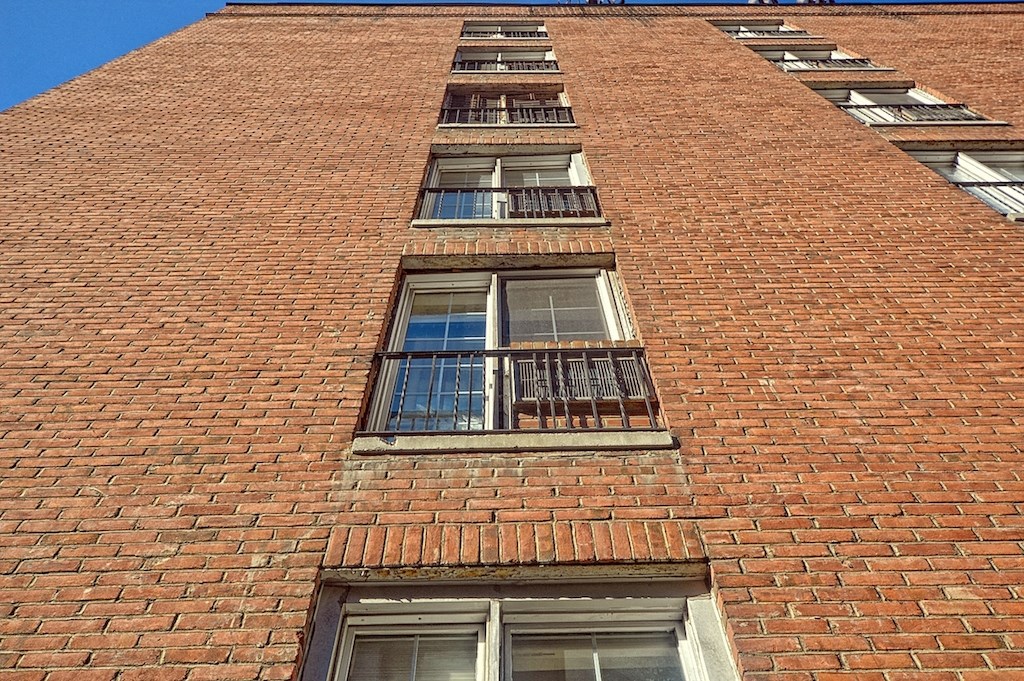 a tall brick building with lots of windows