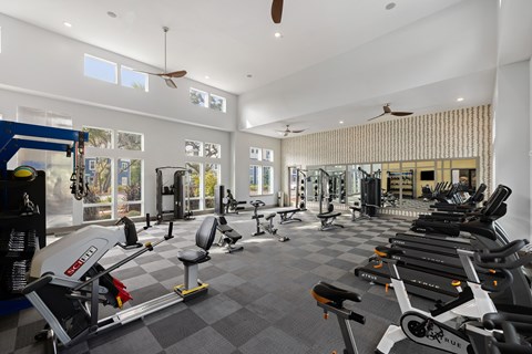 A spacious gym with a variety of exercise equipment.