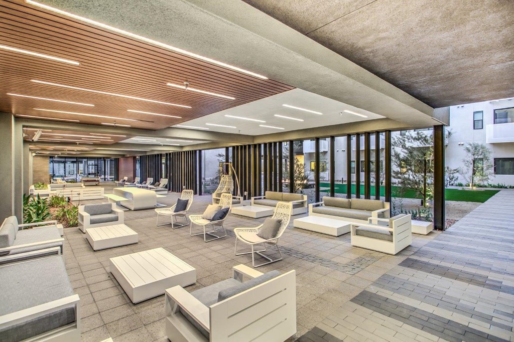 Covered outdoor area with white seating