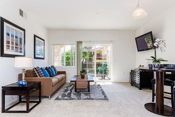 Living room with TV at Greenfield Village in San Diego, California
