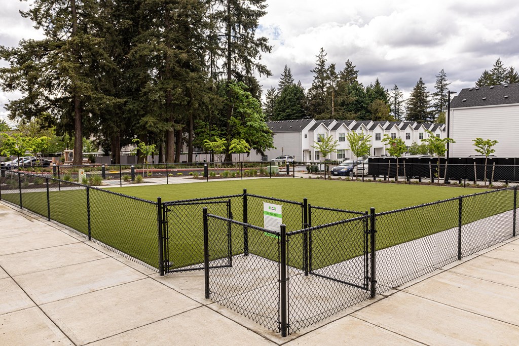 a fenced in soccer field in front of a building at The Farmstead, Vancouver, 98684