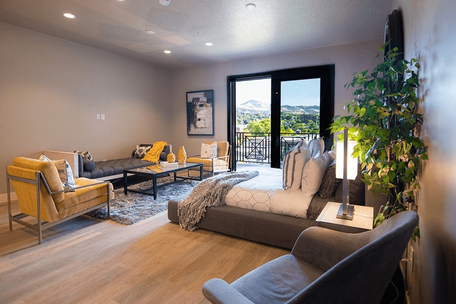 Bedroom with wood flooring and a personal patio