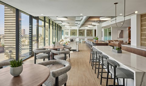 a rendering of a restaurant with tables and chairs and large windows