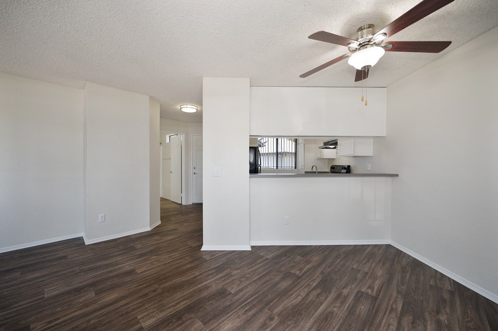a 1-bedroom apartment dining room and kitchen with a ceiling fan