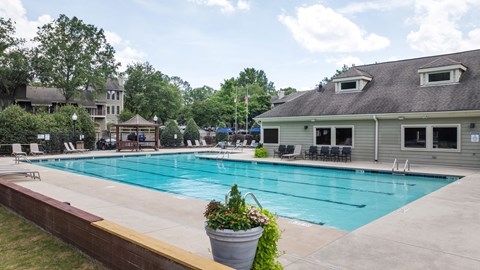 the swimming pool with a building in the background