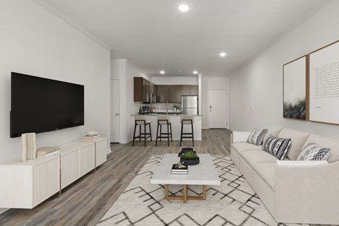 A modern living room with a white couch and a television.