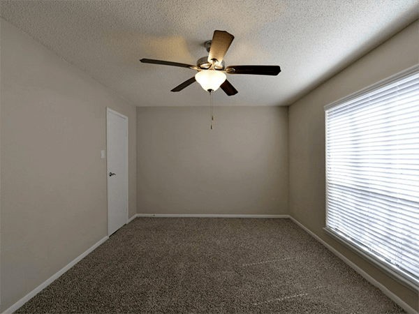 Model home empty bedroom with ceiling fan