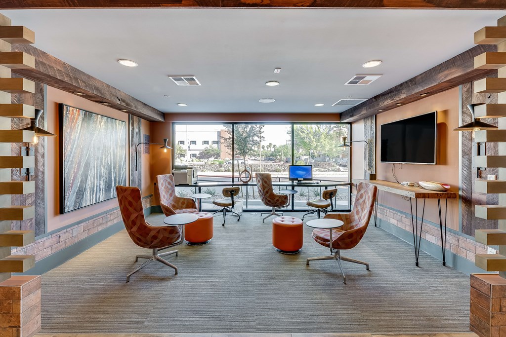 A modern living room with a television and comfortable seating.
