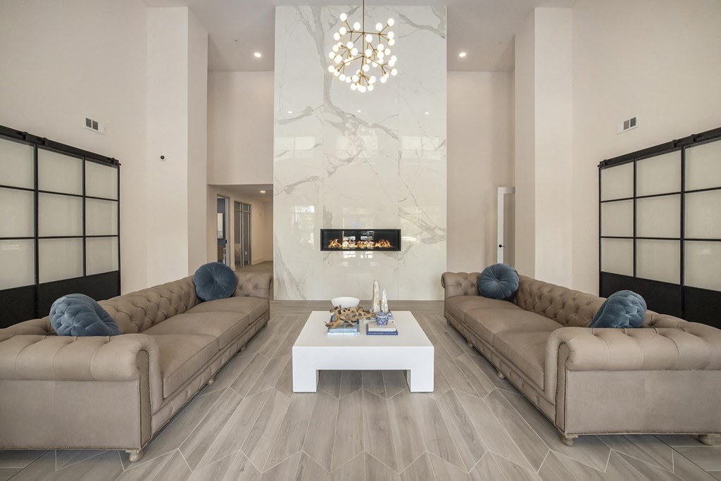 a living room with two couches and a white coffee table