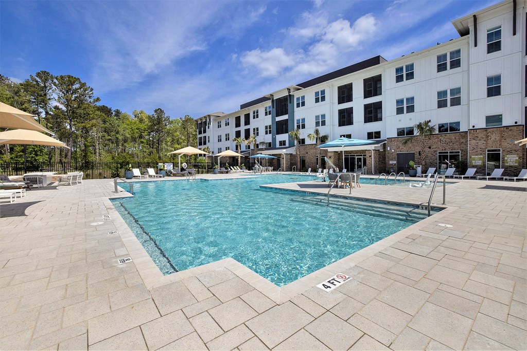 a swimming pool with a building in the background