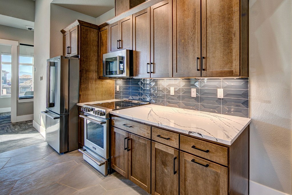 Indoor entertainment kitchen with marble countertops