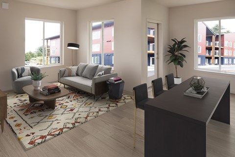 A living room with a grey sofa, a black chair, a coffee table, and a rug with a pattern.