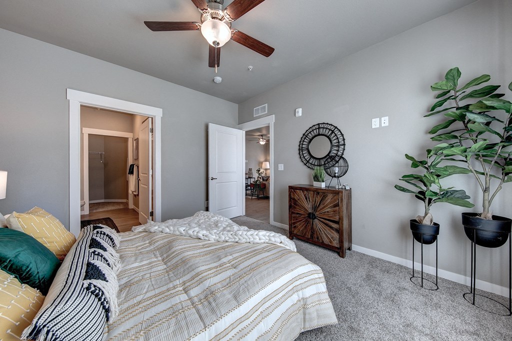 Pelican primary bedroom with bathroom and living room view