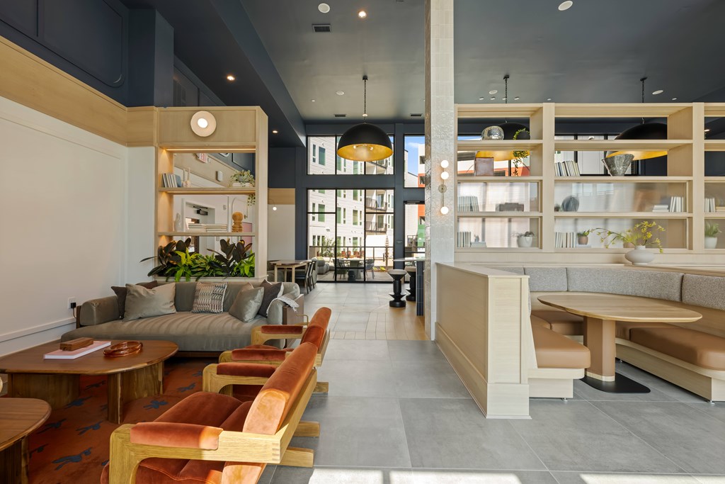 A modern cafe with wooden chairs and tables.