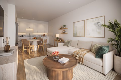 A modern living room with a white sofa and wooden coffee table.