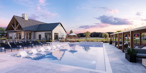 A large outdoor swimming pool with lounge chairs and a house in the background.
