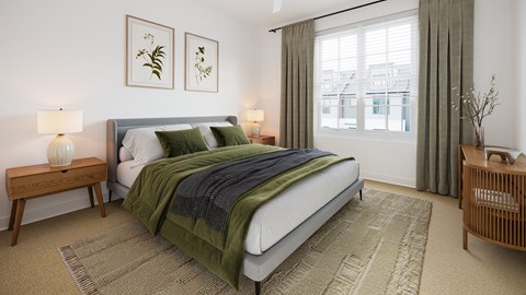 A bedroom with a large bed, a nightstand, and a window with curtains.